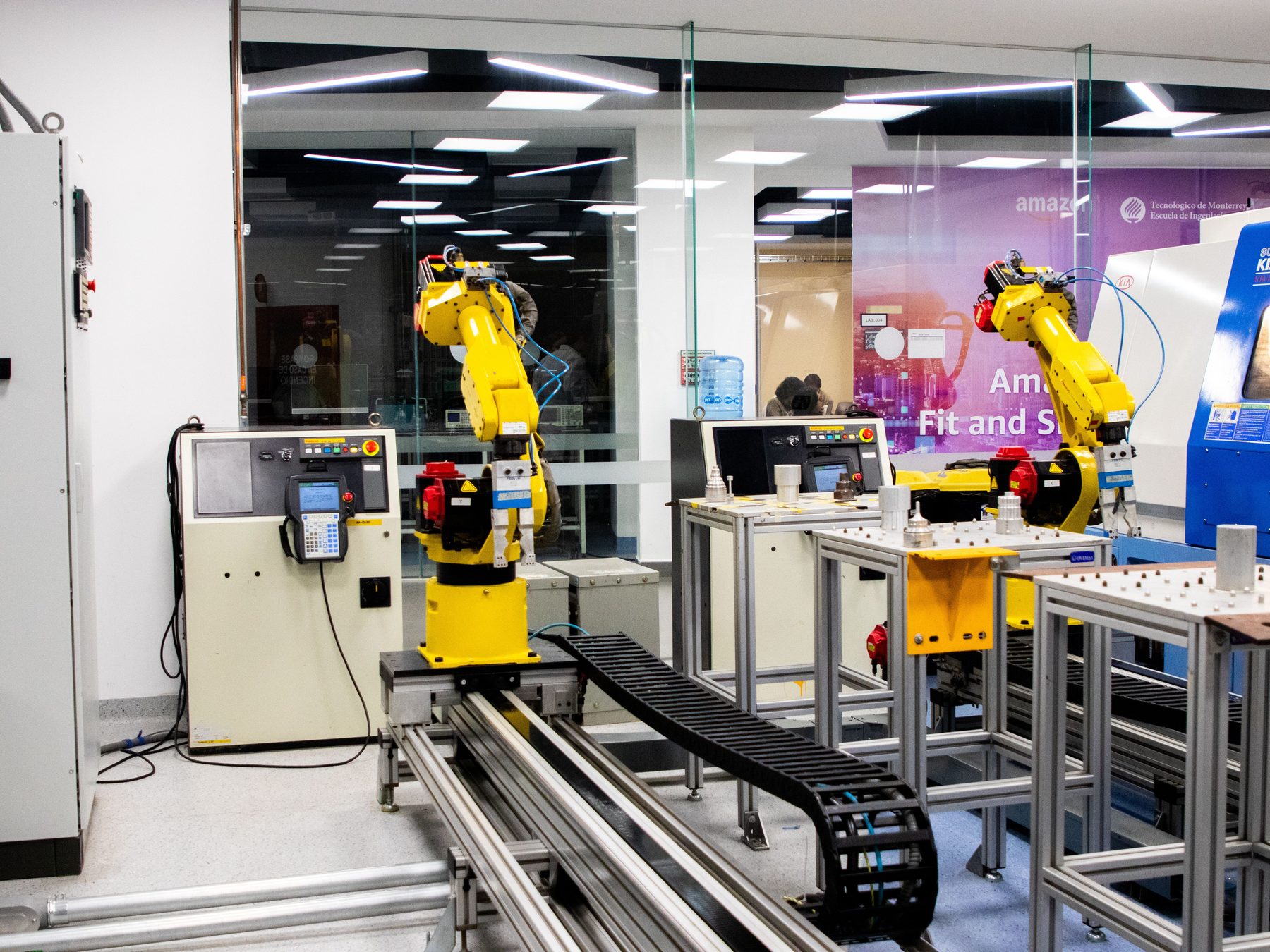 FANUC robotic welding cell with sparks during operation